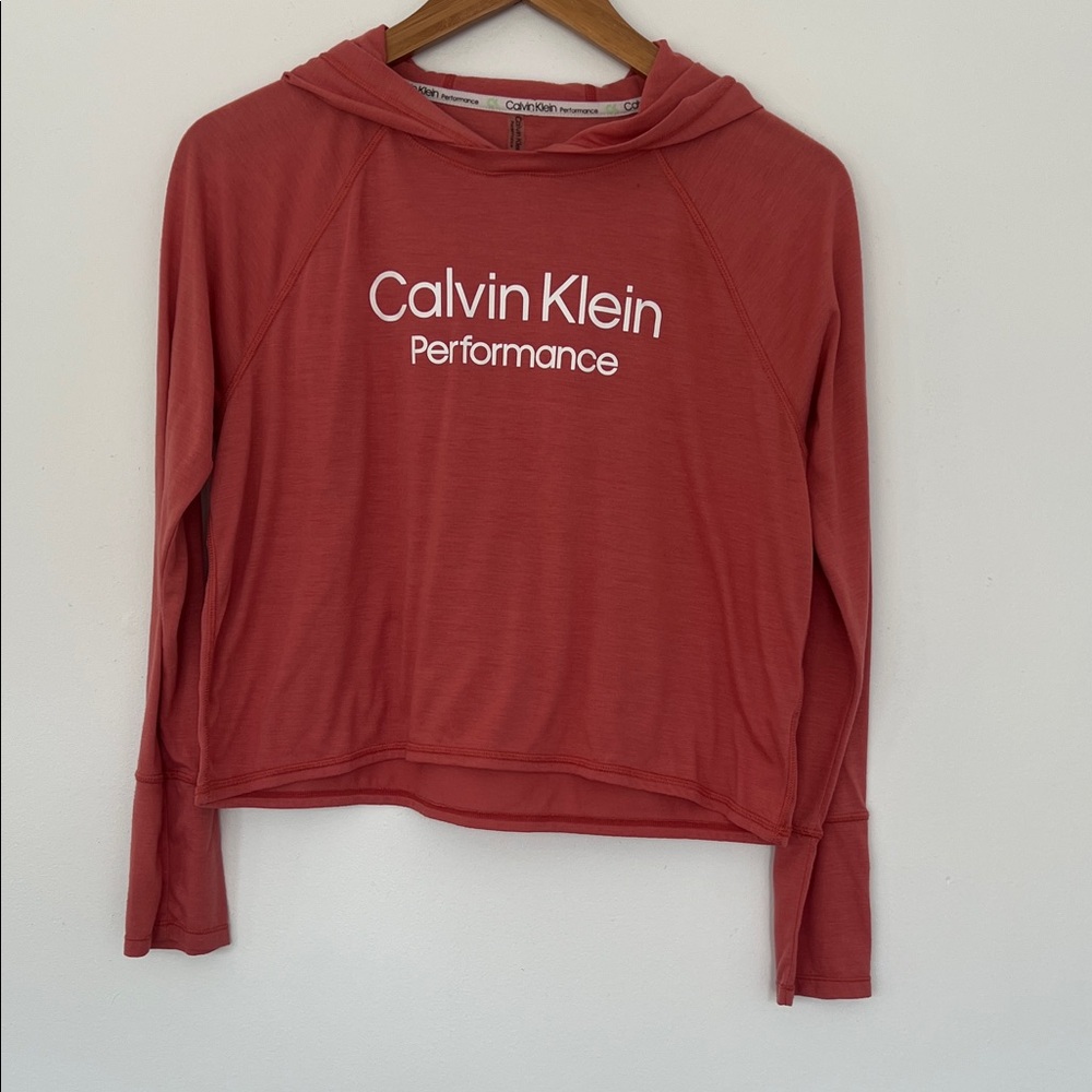 Calvin Klein Performance Women's Stacked Logo Hooded Top in a coral